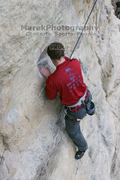 Me top rope climbing Diving for Rocks (5.10d), photographed from  the third bolt of Magster (5.10a) by Andrew Dreher.  It was another long day of rock climbing at Seismic Wall on Austin's Barton Creek Greenbelt, Saturday, April 11, 2009.

Filename: SRM_20090411_17100141.JPG
Aperture: f/5.6
Shutter Speed: 1/320
Body: Canon EOS-1D Mark II
Lens: Canon EF 16-35mm f/2.8 L