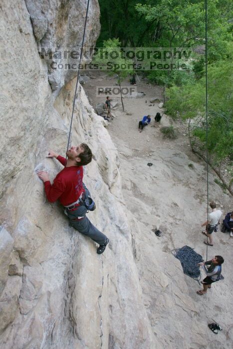 Me top rope climbing Diving for Rocks (5.10d) with Javier Morales belaying, photographed from  the third bolt of Magster (5.10a) by Andrew Dreher.  It was another long day of rock climbing at Seismic Wall on Austin's Barton Creek Greenbelt, Saturday, April 11, 2009.

Filename: SRM_20090411_17100542.JPG
Aperture: f/5.6
Shutter Speed: 1/320
Body: Canon EOS-1D Mark II
Lens: Canon EF 16-35mm f/2.8 L