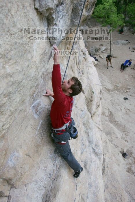 Me top rope climbing Diving for Rocks (5.10d), photographed from  the third bolt of Magster (5.10a) by Andrew Dreher.  It was another long day of rock climbing at Seismic Wall on Austin's Barton Creek Greenbelt, Saturday, April 11, 2009.

Filename: SRM_20090411_17100844.JPG
Aperture: f/5.6
Shutter Speed: 1/320
Body: Canon EOS-1D Mark II
Lens: Canon EF 16-35mm f/2.8 L