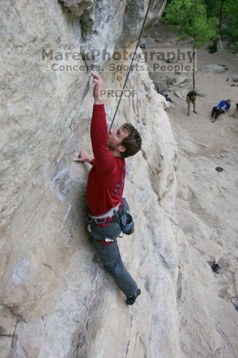 Me top rope climbing Diving for Rocks (5.10d), photographed from  the third bolt of Magster (5.10a) by Andrew Dreher.  It was another long day of rock climbing at Seismic Wall on Austin's Barton Creek Greenbelt, Saturday, April 11, 2009.

Filename: SRM_20090411_17100845.JPG
Aperture: f/5.6
Shutter Speed: 1/320
Body: Canon EOS-1D Mark II
Lens: Canon EF 16-35mm f/2.8 L