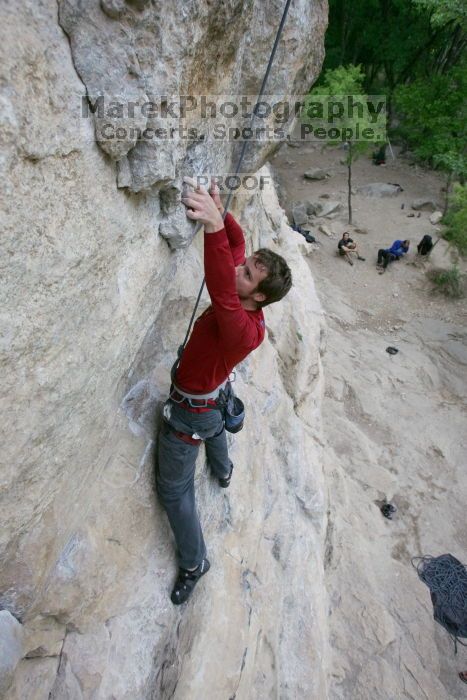 Me top rope climbing Diving for Rocks (5.10d), photographed from  the third bolt of Magster (5.10a) by Andrew Dreher.  It was another long day of rock climbing at Seismic Wall on Austin's Barton Creek Greenbelt, Saturday, April 11, 2009.

Filename: SRM_20090411_17101548.JPG
Aperture: f/5.6
Shutter Speed: 1/320
Body: Canon EOS-1D Mark II
Lens: Canon EF 16-35mm f/2.8 L