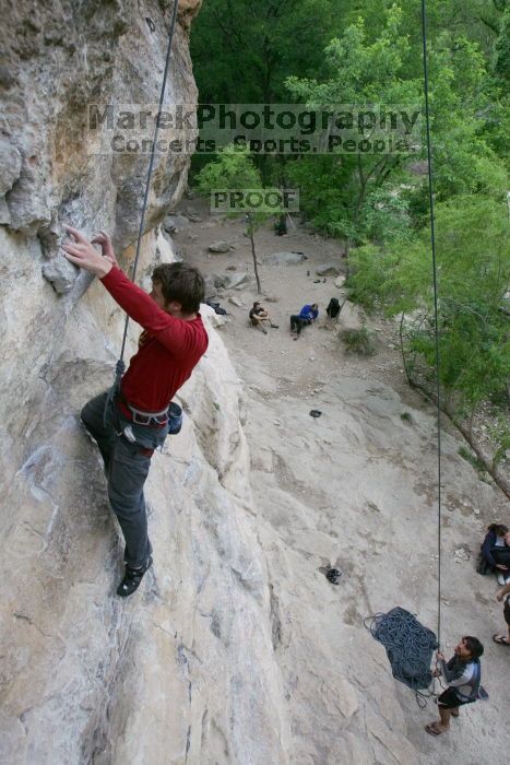 Me top rope climbing Diving for Rocks (5.10d) with Javier Morales belaying, photographed from  the third bolt of Magster (5.10a) by Andrew Dreher.  It was another long day of rock climbing at Seismic Wall on Austin's Barton Creek Greenbelt, Saturday, April 11, 2009.

Filename: SRM_20090411_17102652.JPG
Aperture: f/5.6
Shutter Speed: 1/320
Body: Canon EOS-1D Mark II
Lens: Canon EF 16-35mm f/2.8 L