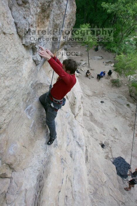 Me top rope climbing Diving for Rocks (5.10d), photographed from  the third bolt of Magster (5.10a) by Andrew Dreher.  It was another long day of rock climbing at Seismic Wall on Austin's Barton Creek Greenbelt, Saturday, April 11, 2009.

Filename: SRM_20090411_17102953.JPG
Aperture: f/5.6
Shutter Speed: 1/320
Body: Canon EOS-1D Mark II
Lens: Canon EF 16-35mm f/2.8 L