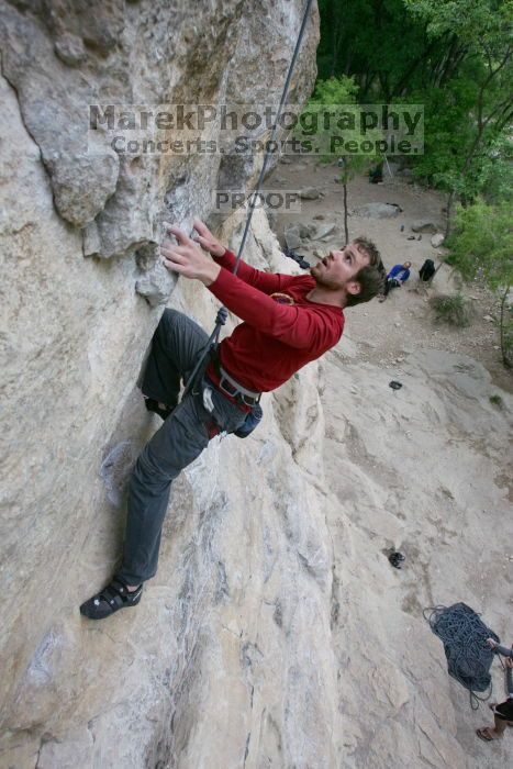 Me top rope climbing Diving for Rocks (5.10d), photographed from  the third bolt of Magster (5.10a) by Andrew Dreher.  It was another long day of rock climbing at Seismic Wall on Austin's Barton Creek Greenbelt, Saturday, April 11, 2009.

Filename: SRM_20090411_17103355.JPG
Aperture: f/5.6
Shutter Speed: 1/320
Body: Canon EOS-1D Mark II
Lens: Canon EF 16-35mm f/2.8 L