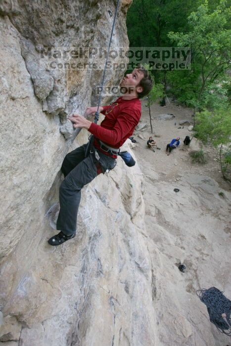 Me top rope climbing Diving for Rocks (5.10d), photographed from  the third bolt of Magster (5.10a) by Andrew Dreher.  It was another long day of rock climbing at Seismic Wall on Austin's Barton Creek Greenbelt, Saturday, April 11, 2009.

Filename: SRM_20090411_17103659.JPG
Aperture: f/5.6
Shutter Speed: 1/320
Body: Canon EOS-1D Mark II
Lens: Canon EF 16-35mm f/2.8 L