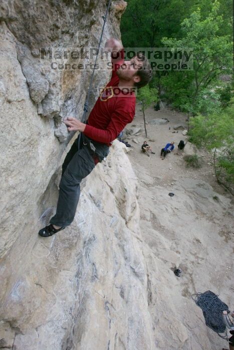 Me top rope climbing Diving for Rocks (5.10d), photographed from  the third bolt of Magster (5.10a) by Andrew Dreher.  It was another long day of rock climbing at Seismic Wall on Austin's Barton Creek Greenbelt, Saturday, April 11, 2009.

Filename: SRM_20090411_17103660.JPG
Aperture: f/5.6
Shutter Speed: 1/320
Body: Canon EOS-1D Mark II
Lens: Canon EF 16-35mm f/2.8 L