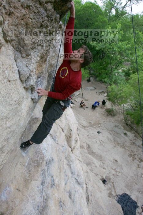 Me top rope climbing Diving for Rocks (5.10d), photographed from  the third bolt of Magster (5.10a) by Andrew Dreher.  It was another long day of rock climbing at Seismic Wall on Austin's Barton Creek Greenbelt, Saturday, April 11, 2009.

Filename: SRM_20090411_17103662.JPG
Aperture: f/5.6
Shutter Speed: 1/320
Body: Canon EOS-1D Mark II
Lens: Canon EF 16-35mm f/2.8 L