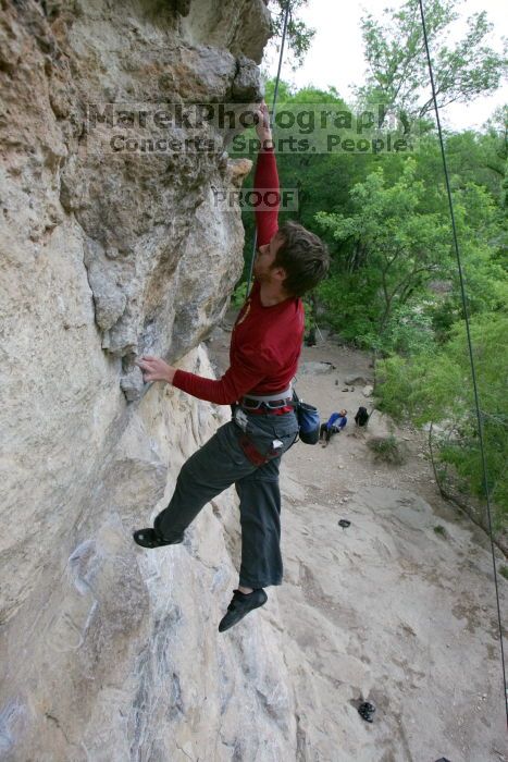 Me top rope climbing Diving for Rocks (5.10d), photographed from  the third bolt of Magster (5.10a) by Andrew Dreher.  It was another long day of rock climbing at Seismic Wall on Austin's Barton Creek Greenbelt, Saturday, April 11, 2009.

Filename: SRM_20090411_17103765.JPG
Aperture: f/5.6
Shutter Speed: 1/320
Body: Canon EOS-1D Mark II
Lens: Canon EF 16-35mm f/2.8 L