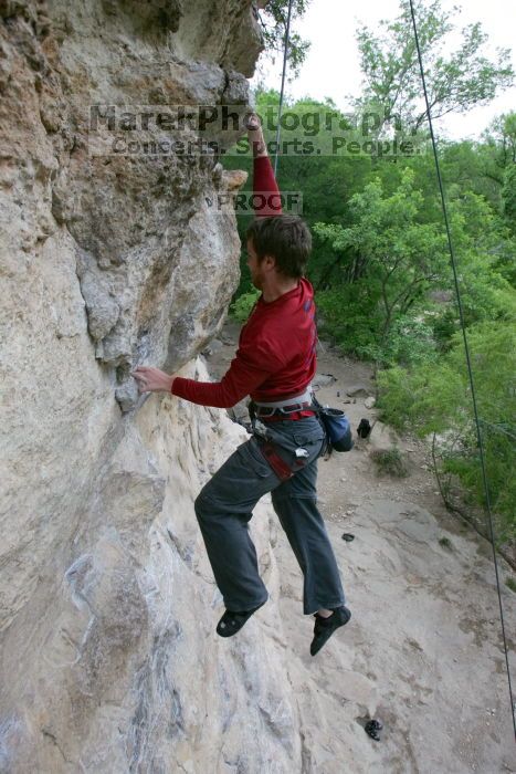 Me top rope climbing Diving for Rocks (5.10d), photographed from  the third bolt of Magster (5.10a) by Andrew Dreher.  It was another long day of rock climbing at Seismic Wall on Austin's Barton Creek Greenbelt, Saturday, April 11, 2009.

Filename: SRM_20090411_17103768.JPG
Aperture: f/5.6
Shutter Speed: 1/320
Body: Canon EOS-1D Mark II
Lens: Canon EF 16-35mm f/2.8 L