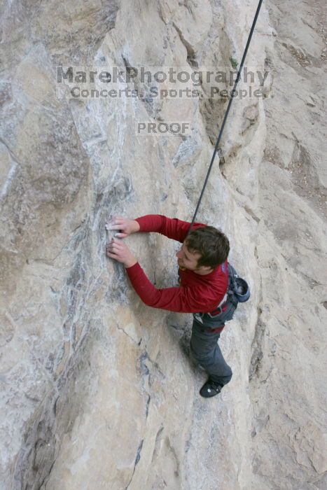 Me top rope climbing Diving for Rocks (5.10d), photographed from  the third bolt of Magster (5.10a) by Andrew Dreher.  It was another long day of rock climbing at Seismic Wall on Austin's Barton Creek Greenbelt, Saturday, April 11, 2009.

Filename: SRM_20090411_17113871.JPG
Aperture: f/5.6
Shutter Speed: 1/320
Body: Canon EOS-1D Mark II
Lens: Canon EF 16-35mm f/2.8 L