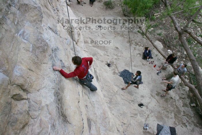 Me top rope climbing Diving for Rocks (5.10d) with Javier Morales belaying, photographed from  the third bolt of Magster (5.10a) by Andrew Dreher.  It was another long day of rock climbing at Seismic Wall on Austin's Barton Creek Greenbelt, Saturday, April 11, 2009.

Filename: SRM_20090411_17114472.JPG
Aperture: f/5.6
Shutter Speed: 1/320
Body: Canon EOS-1D Mark II
Lens: Canon EF 16-35mm f/2.8 L