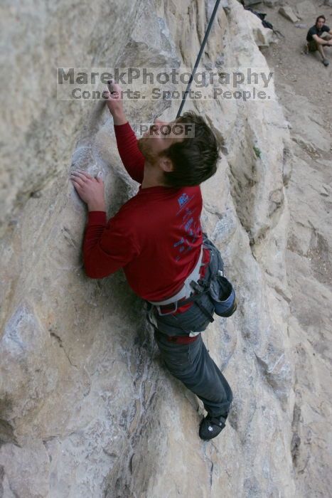 Me top rope climbing Diving for Rocks (5.10d), photographed from  the third bolt of Magster (5.10a) by Andrew Dreher.  It was another long day of rock climbing at Seismic Wall on Austin's Barton Creek Greenbelt, Saturday, April 11, 2009.

Filename: SRM_20090411_17122576.JPG
Aperture: f/5.6
Shutter Speed: 1/320
Body: Canon EOS-1D Mark II
Lens: Canon EF 16-35mm f/2.8 L