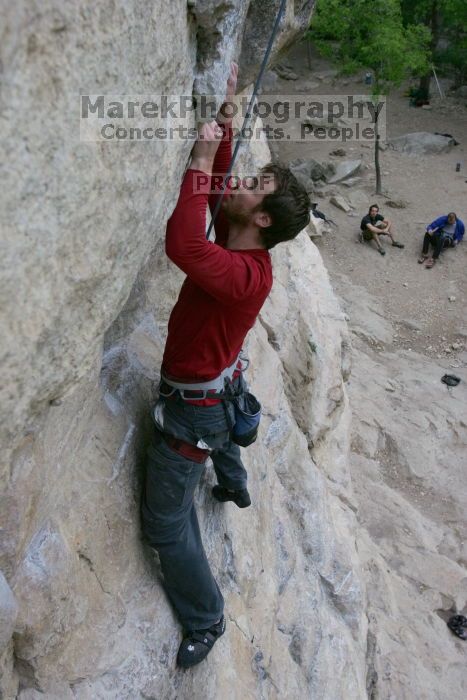 Me top rope climbing Diving for Rocks (5.10d), photographed from  the third bolt of Magster (5.10a) by Andrew Dreher.  It was another long day of rock climbing at Seismic Wall on Austin's Barton Creek Greenbelt, Saturday, April 11, 2009.

Filename: SRM_20090411_17123578.JPG
Aperture: f/5.6
Shutter Speed: 1/320
Body: Canon EOS-1D Mark II
Lens: Canon EF 16-35mm f/2.8 L