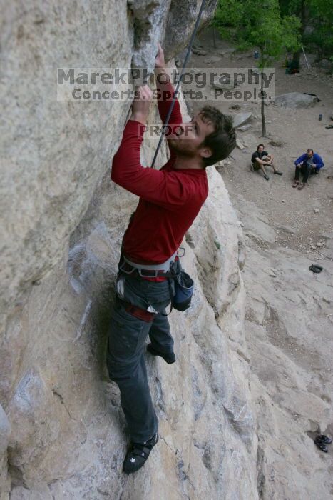 Me top rope climbing Diving for Rocks (5.10d), photographed from  the third bolt of Magster (5.10a) by Andrew Dreher.  It was another long day of rock climbing at Seismic Wall on Austin's Barton Creek Greenbelt, Saturday, April 11, 2009.

Filename: SRM_20090411_17123779.JPG
Aperture: f/5.6
Shutter Speed: 1/320
Body: Canon EOS-1D Mark II
Lens: Canon EF 16-35mm f/2.8 L