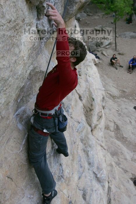 Me top rope climbing Diving for Rocks (5.10d), photographed from  the third bolt of Magster (5.10a) by Andrew Dreher.  It was another long day of rock climbing at Seismic Wall on Austin's Barton Creek Greenbelt, Saturday, April 11, 2009.

Filename: SRM_20090411_17124080.JPG
Aperture: f/5.6
Shutter Speed: 1/320
Body: Canon EOS-1D Mark II
Lens: Canon EF 16-35mm f/2.8 L