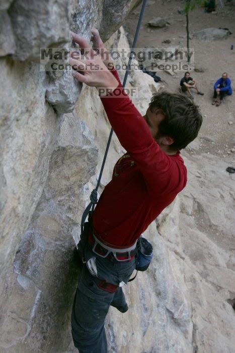 Me top rope climbing Diving for Rocks (5.10d), photographed from  the third bolt of Magster (5.10a) by Andrew Dreher.  It was another long day of rock climbing at Seismic Wall on Austin's Barton Creek Greenbelt, Saturday, April 11, 2009.

Filename: SRM_20090411_17124681.JPG
Aperture: f/5.6
Shutter Speed: 1/320
Body: Canon EOS-1D Mark II
Lens: Canon EF 16-35mm f/2.8 L