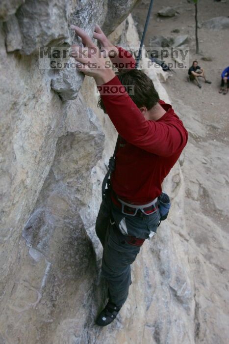 Me top rope climbing Diving for Rocks (5.10d), photographed from  the third bolt of Magster (5.10a) by Andrew Dreher.  It was another long day of rock climbing at Seismic Wall on Austin's Barton Creek Greenbelt, Saturday, April 11, 2009.

Filename: SRM_20090411_17124882.JPG
Aperture: f/5.6
Shutter Speed: 1/320
Body: Canon EOS-1D Mark II
Lens: Canon EF 16-35mm f/2.8 L