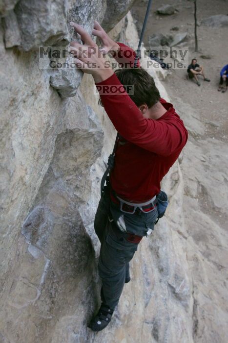 Me top rope climbing Diving for Rocks (5.10d), photographed from  the third bolt of Magster (5.10a) by Andrew Dreher.  It was another long day of rock climbing at Seismic Wall on Austin's Barton Creek Greenbelt, Saturday, April 11, 2009.

Filename: SRM_20090411_17124883.JPG
Aperture: f/5.6
Shutter Speed: 1/320
Body: Canon EOS-1D Mark II
Lens: Canon EF 16-35mm f/2.8 L