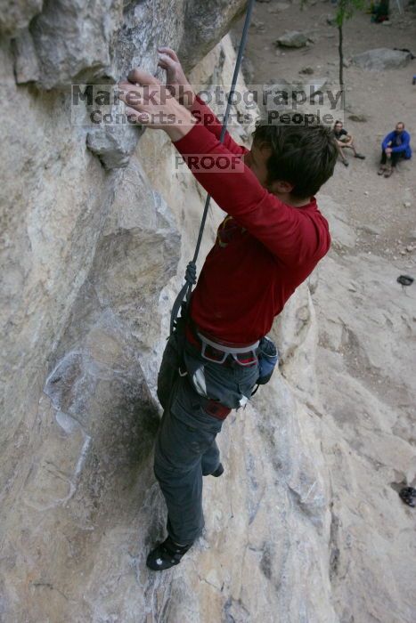 Me top rope climbing Diving for Rocks (5.10d), photographed from  the third bolt of Magster (5.10a) by Andrew Dreher.  It was another long day of rock climbing at Seismic Wall on Austin's Barton Creek Greenbelt, Saturday, April 11, 2009.

Filename: SRM_20090411_17125184.JPG
Aperture: f/5.6
Shutter Speed: 1/320
Body: Canon EOS-1D Mark II
Lens: Canon EF 16-35mm f/2.8 L