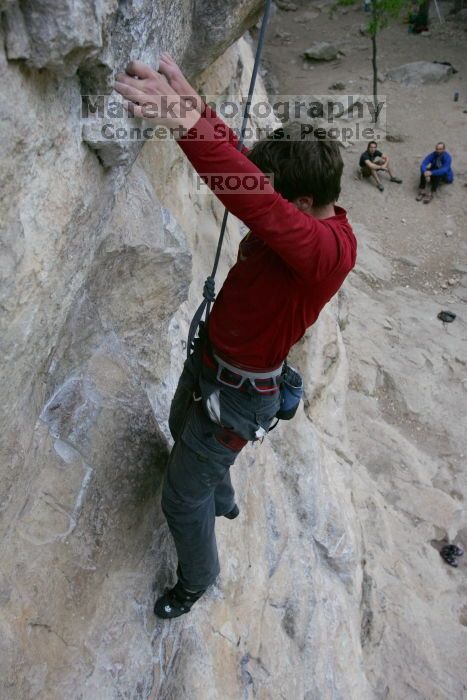 Me top rope climbing Diving for Rocks (5.10d), photographed from  the third bolt of Magster (5.10a) by Andrew Dreher.  It was another long day of rock climbing at Seismic Wall on Austin's Barton Creek Greenbelt, Saturday, April 11, 2009.

Filename: SRM_20090411_17125385.JPG
Aperture: f/5.6
Shutter Speed: 1/320
Body: Canon EOS-1D Mark II
Lens: Canon EF 16-35mm f/2.8 L