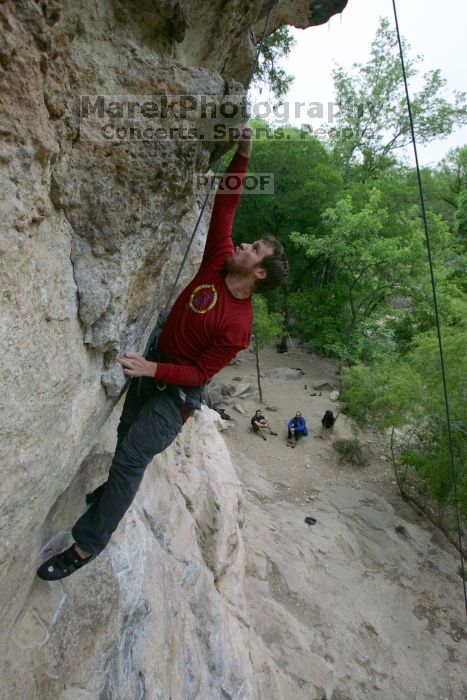 Me top rope climbing Diving for Rocks (5.10d), photographed from  the third bolt of Magster (5.10a) by Andrew Dreher.  It was another long day of rock climbing at Seismic Wall on Austin's Barton Creek Greenbelt, Saturday, April 11, 2009.

Filename: SRM_20090411_17125888.JPG
Aperture: f/5.6
Shutter Speed: 1/320
Body: Canon EOS-1D Mark II
Lens: Canon EF 16-35mm f/2.8 L