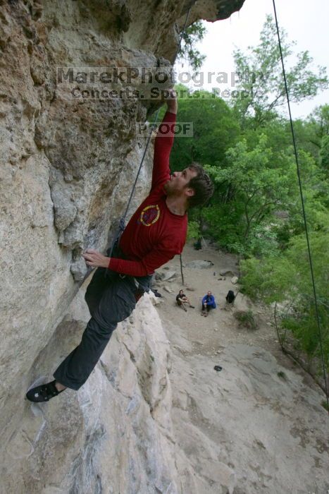 Me top rope climbing Diving for Rocks (5.10d), photographed from  the third bolt of Magster (5.10a) by Andrew Dreher.  It was another long day of rock climbing at Seismic Wall on Austin's Barton Creek Greenbelt, Saturday, April 11, 2009.

Filename: SRM_20090411_17125889.JPG
Aperture: f/5.6
Shutter Speed: 1/320
Body: Canon EOS-1D Mark II
Lens: Canon EF 16-35mm f/2.8 L