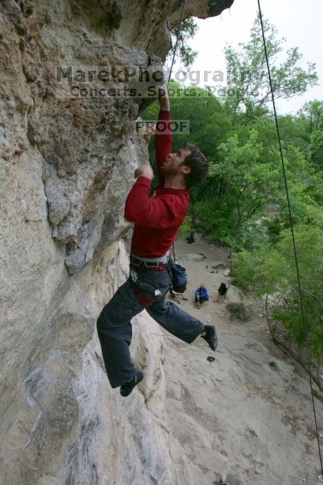 Me top rope climbing Diving for Rocks (5.10d), photographed from  the third bolt of Magster (5.10a) by Andrew Dreher.  It was another long day of rock climbing at Seismic Wall on Austin's Barton Creek Greenbelt, Saturday, April 11, 2009.

Filename: SRM_20090411_17125992.JPG
Aperture: f/5.6
Shutter Speed: 1/320
Body: Canon EOS-1D Mark II
Lens: Canon EF 16-35mm f/2.8 L