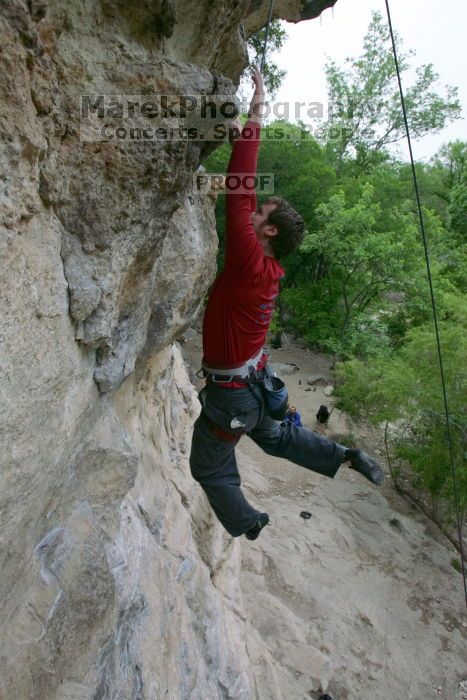 Me top rope climbing Diving for Rocks (5.10d), photographed from  the third bolt of Magster (5.10a) by Andrew Dreher.  It was another long day of rock climbing at Seismic Wall on Austin's Barton Creek Greenbelt, Saturday, April 11, 2009.

Filename: SRM_20090411_17125993.JPG
Aperture: f/5.6
Shutter Speed: 1/320
Body: Canon EOS-1D Mark II
Lens: Canon EF 16-35mm f/2.8 L