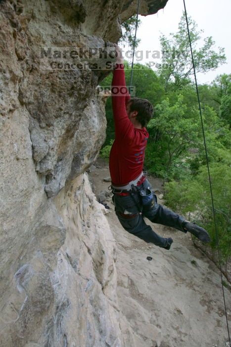 Me top rope climbing Diving for Rocks (5.10d), photographed from  the third bolt of Magster (5.10a) by Andrew Dreher.  It was another long day of rock climbing at Seismic Wall on Austin's Barton Creek Greenbelt, Saturday, April 11, 2009.

Filename: SRM_20090411_17125994.JPG
Aperture: f/5.6
Shutter Speed: 1/320
Body: Canon EOS-1D Mark II
Lens: Canon EF 16-35mm f/2.8 L