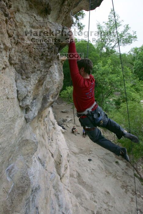 Me top rope climbing Diving for Rocks (5.10d), photographed from  the third bolt of Magster (5.10a) by Andrew Dreher.  It was another long day of rock climbing at Seismic Wall on Austin's Barton Creek Greenbelt, Saturday, April 11, 2009.

Filename: SRM_20090411_17125996.JPG
Aperture: f/5.6
Shutter Speed: 1/320
Body: Canon EOS-1D Mark II
Lens: Canon EF 16-35mm f/2.8 L