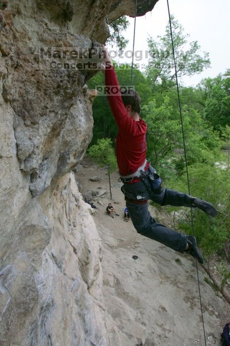 Me top rope climbing Diving for Rocks (5.10d), photographed from  the third bolt of Magster (5.10a) by Andrew Dreher.  It was another long day of rock climbing at Seismic Wall on Austin's Barton Creek Greenbelt, Saturday, April 11, 2009.

Filename: SRM_20090411_17125998.JPG
Aperture: f/5.6
Shutter Speed: 1/320
Body: Canon EOS-1D Mark II
Lens: Canon EF 16-35mm f/2.8 L