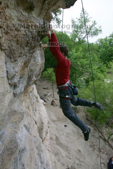 Me top rope climbing Diving for Rocks (5.10d), photographed from  the third bolt of Magster (5.10a) by Andrew Dreher.  It was another long day of rock climbing at Seismic Wall on Austin's Barton Creek Greenbelt, Saturday, April 11, 2009.

Filename: SRM_20090411_17125999.JPG
Aperture: f/5.6
Shutter Speed: 1/320
Body: Canon EOS-1D Mark II
Lens: Canon EF 16-35mm f/2.8 L