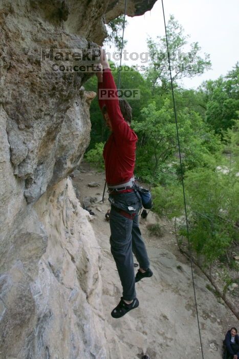 Me top rope climbing Diving for Rocks (5.10d), photographed from  the third bolt of Magster (5.10a) by Andrew Dreher.  It was another long day of rock climbing at Seismic Wall on Austin's Barton Creek Greenbelt, Saturday, April 11, 2009.

Filename: SRM_20090411_17130001.JPG
Aperture: f/5.6
Shutter Speed: 1/320
Body: Canon EOS-1D Mark II
Lens: Canon EF 16-35mm f/2.8 L