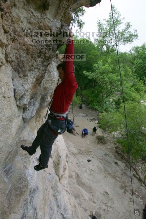 Me top rope climbing Diving for Rocks (5.10d), photographed from  the third bolt of Magster (5.10a) by Andrew Dreher.  It was another long day of rock climbing at Seismic Wall on Austin's Barton Creek Greenbelt, Saturday, April 11, 2009.

Filename: SRM_20090411_17130102.JPG
Aperture: f/5.6
Shutter Speed: 1/320
Body: Canon EOS-1D Mark II
Lens: Canon EF 16-35mm f/2.8 L