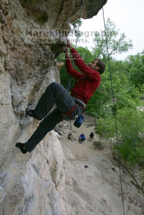 Me top rope climbing Diving for Rocks (5.10d), photographed from  the third bolt of Magster (5.10a) by Andrew Dreher.  It was another long day of rock climbing at Seismic Wall on Austin's Barton Creek Greenbelt, Saturday, April 11, 2009.

Filename: SRM_20090411_17130407.JPG
Aperture: f/5.6
Shutter Speed: 1/320
Body: Canon EOS-1D Mark II
Lens: Canon EF 16-35mm f/2.8 L