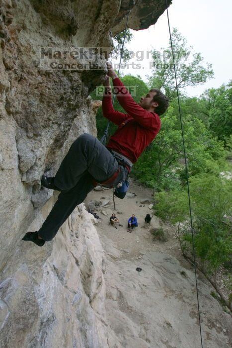 Me top rope climbing Diving for Rocks (5.10d), photographed from  the third bolt of Magster (5.10a) by Andrew Dreher.  It was another long day of rock climbing at Seismic Wall on Austin's Barton Creek Greenbelt, Saturday, April 11, 2009.

Filename: SRM_20090411_17130408.JPG
Aperture: f/5.6
Shutter Speed: 1/320
Body: Canon EOS-1D Mark II
Lens: Canon EF 16-35mm f/2.8 L