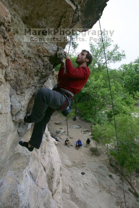 Me top rope climbing Diving for Rocks (5.10d), photographed from  the third bolt of Magster (5.10a) by Andrew Dreher.  It was another long day of rock climbing at Seismic Wall on Austin's Barton Creek Greenbelt, Saturday, April 11, 2009.

Filename: SRM_20090411_17130509.JPG
Aperture: f/5.6
Shutter Speed: 1/320
Body: Canon EOS-1D Mark II
Lens: Canon EF 16-35mm f/2.8 L