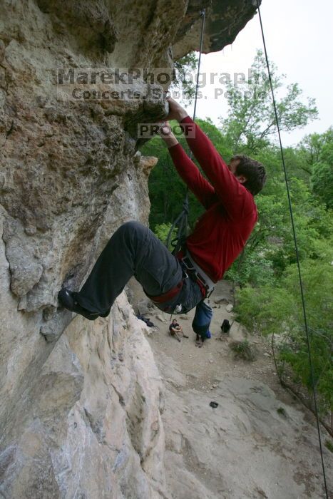 Me top rope climbing Diving for Rocks (5.10d), photographed from  the third bolt of Magster (5.10a) by Andrew Dreher.  It was another long day of rock climbing at Seismic Wall on Austin's Barton Creek Greenbelt, Saturday, April 11, 2009.

Filename: SRM_20090411_17130811.JPG
Aperture: f/5.6
Shutter Speed: 1/320
Body: Canon EOS-1D Mark II
Lens: Canon EF 16-35mm f/2.8 L