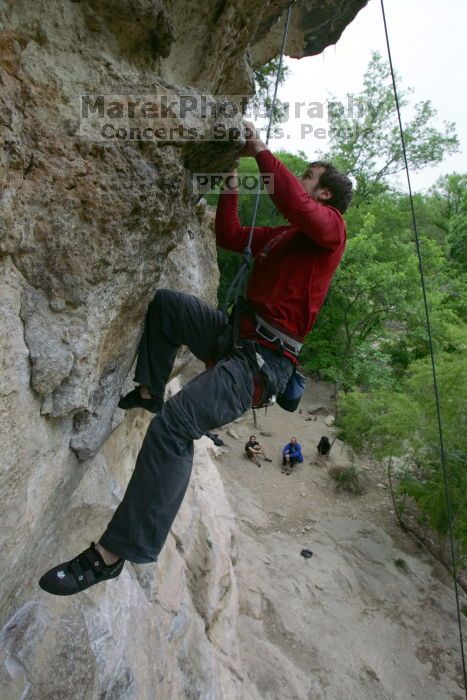 Me top rope climbing Diving for Rocks (5.10d), photographed from  the third bolt of Magster (5.10a) by Andrew Dreher.  It was another long day of rock climbing at Seismic Wall on Austin's Barton Creek Greenbelt, Saturday, April 11, 2009.

Filename: SRM_20090411_17131012.JPG
Aperture: f/5.6
Shutter Speed: 1/320
Body: Canon EOS-1D Mark II
Lens: Canon EF 16-35mm f/2.8 L