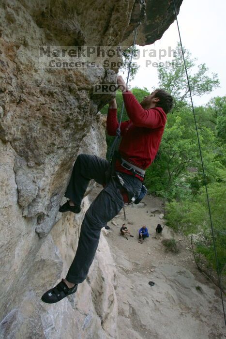 Me top rope climbing Diving for Rocks (5.10d), photographed from  the third bolt of Magster (5.10a) by Andrew Dreher.  It was another long day of rock climbing at Seismic Wall on Austin's Barton Creek Greenbelt, Saturday, April 11, 2009.

Filename: SRM_20090411_17131113.JPG
Aperture: f/5.6
Shutter Speed: 1/320
Body: Canon EOS-1D Mark II
Lens: Canon EF 16-35mm f/2.8 L