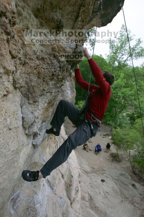 Me top rope climbing Diving for Rocks (5.10d), photographed from  the third bolt of Magster (5.10a) by Andrew Dreher.  It was another long day of rock climbing at Seismic Wall on Austin's Barton Creek Greenbelt, Saturday, April 11, 2009.

Filename: SRM_20090411_17131416.JPG
Aperture: f/5.6
Shutter Speed: 1/320
Body: Canon EOS-1D Mark II
Lens: Canon EF 16-35mm f/2.8 L