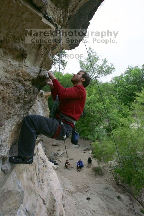 Me top rope climbing Diving for Rocks (5.10d), photographed from  the third bolt of Magster (5.10a) by Andrew Dreher.  It was another long day of rock climbing at Seismic Wall on Austin's Barton Creek Greenbelt, Saturday, April 11, 2009.

Filename: SRM_20090411_17132217.JPG
Aperture: f/5.6
Shutter Speed: 1/320
Body: Canon EOS-1D Mark II
Lens: Canon EF 16-35mm f/2.8 L