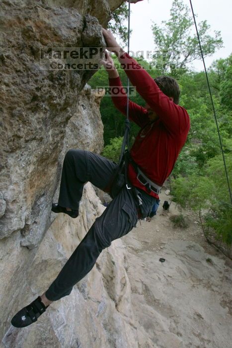 Me top rope climbing Diving for Rocks (5.10d), photographed from  the third bolt of Magster (5.10a) by Andrew Dreher.  It was another long day of rock climbing at Seismic Wall on Austin's Barton Creek Greenbelt, Saturday, April 11, 2009.

Filename: SRM_20090411_17132619.JPG
Aperture: f/5.6
Shutter Speed: 1/320
Body: Canon EOS-1D Mark II
Lens: Canon EF 16-35mm f/2.8 L