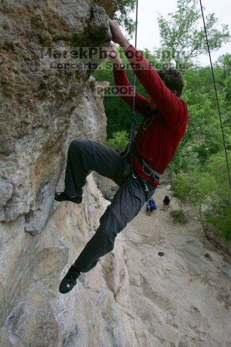 Me top rope climbing Diving for Rocks (5.10d), photographed from  the third bolt of Magster (5.10a) by Andrew Dreher.  It was another long day of rock climbing at Seismic Wall on Austin's Barton Creek Greenbelt, Saturday, April 11, 2009.

Filename: SRM_20090411_17132721.JPG
Aperture: f/5.6
Shutter Speed: 1/320
Body: Canon EOS-1D Mark II
Lens: Canon EF 16-35mm f/2.8 L