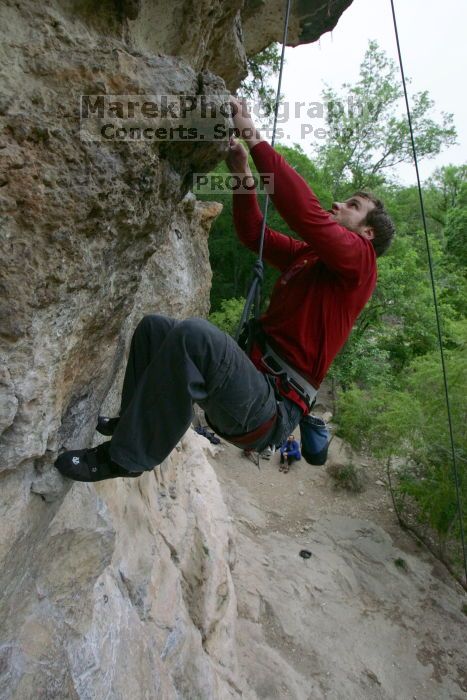 Me top rope climbing Diving for Rocks (5.10d), photographed from  the third bolt of Magster (5.10a) by Andrew Dreher.  It was another long day of rock climbing at Seismic Wall on Austin's Barton Creek Greenbelt, Saturday, April 11, 2009.

Filename: SRM_20090411_17132822.JPG
Aperture: f/5.6
Shutter Speed: 1/320
Body: Canon EOS-1D Mark II
Lens: Canon EF 16-35mm f/2.8 L