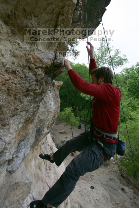 Me top rope climbing Diving for Rocks (5.10d), photographed from  the third bolt of Magster (5.10a) by Andrew Dreher.  It was another long day of rock climbing at Seismic Wall on Austin's Barton Creek Greenbelt, Saturday, April 11, 2009.

Filename: SRM_20090411_17133024.JPG
Aperture: f/5.6
Shutter Speed: 1/320
Body: Canon EOS-1D Mark II
Lens: Canon EF 16-35mm f/2.8 L