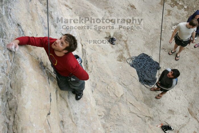 Me top rope climbing Diving for Rocks (5.10d) with Javier Morales belaying, photographed from  the third bolt of Magster (5.10a) by Andrew Dreher.  It was another long day of rock climbing at Seismic Wall on Austin's Barton Creek Greenbelt, Saturday, April 11, 2009.

Filename: SRM_20090411_17160928.JPG
Aperture: f/5.6
Shutter Speed: 1/320
Body: Canon EOS-1D Mark II
Lens: Canon EF 16-35mm f/2.8 L