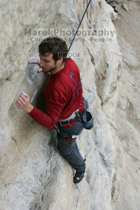 Me top rope climbing Diving for Rocks (5.10d), photographed from  the third bolt of Magster (5.10a) by Andrew Dreher.  It was another long day of rock climbing at Seismic Wall on Austin's Barton Creek Greenbelt, Saturday, April 11, 2009.

Filename: SRM_20090411_17162829.JPG
Aperture: f/5.6
Shutter Speed: 1/320
Body: Canon EOS-1D Mark II
Lens: Canon EF 16-35mm f/2.8 L