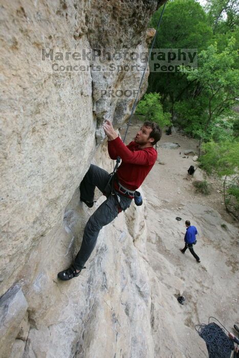 Me top rope climbing Diving for Rocks (5.10d), photographed from  the third bolt of Magster (5.10a) by Andrew Dreher.  It was another long day of rock climbing at Seismic Wall on Austin's Barton Creek Greenbelt, Saturday, April 11, 2009.

Filename: SRM_20090411_17164836.JPG
Aperture: f/5.6
Shutter Speed: 1/320
Body: Canon EOS-1D Mark II
Lens: Canon EF 16-35mm f/2.8 L