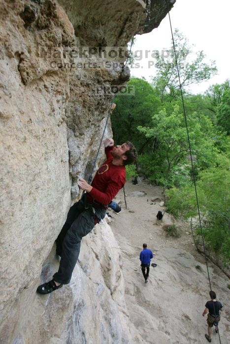 Me top rope climbing Diving for Rocks (5.10d), photographed from  the third bolt of Magster (5.10a) by Andrew Dreher.  It was another long day of rock climbing at Seismic Wall on Austin's Barton Creek Greenbelt, Saturday, April 11, 2009.

Filename: SRM_20090411_17164937.JPG
Aperture: f/5.6
Shutter Speed: 1/320
Body: Canon EOS-1D Mark II
Lens: Canon EF 16-35mm f/2.8 L